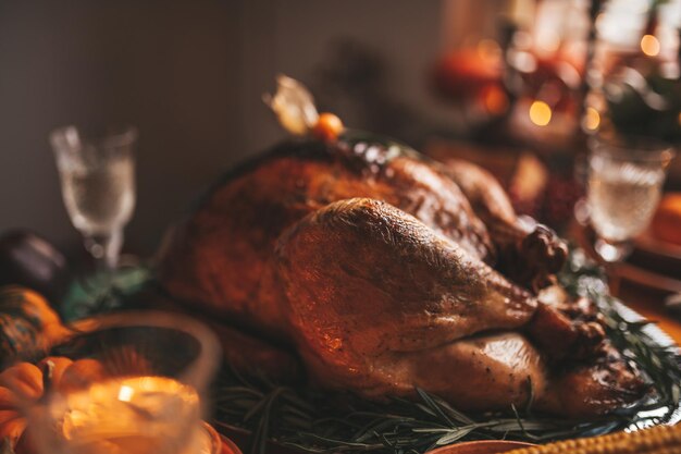 Thanksgiving holiday dinner table setting with fall decoration and pumpkins