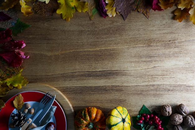 Thanksgiving pumpkins with fruits and falling leaves