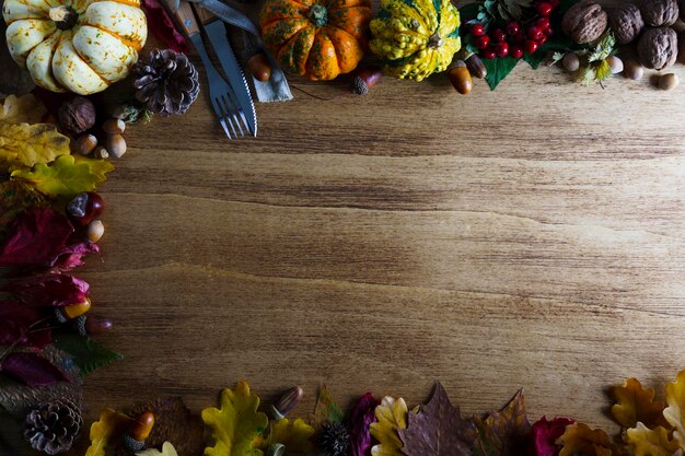 Thanksgiving pumpkins with fruits and falling leaves