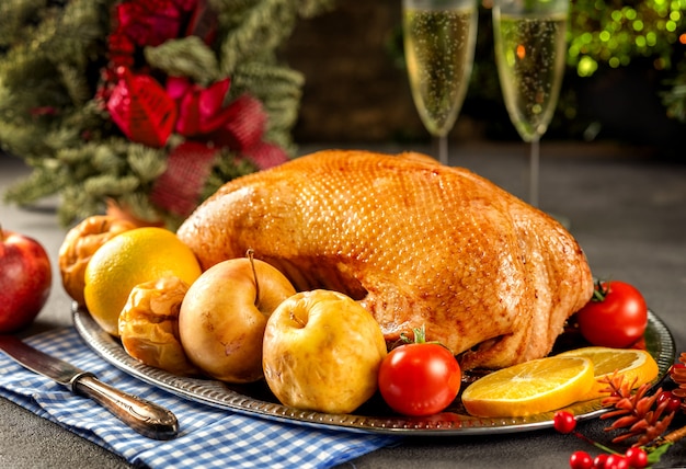 Thanksgiving roasted goose on rustic table