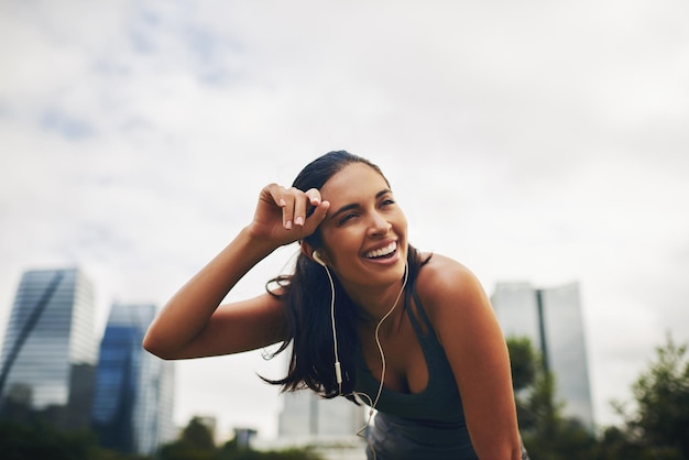 That feeling of setting a personal best Cropped shot of an attractive young sportswoman taking a break from working out outdoors