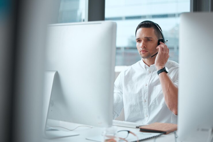 Photo that a serious problem shot of a young male call center worker