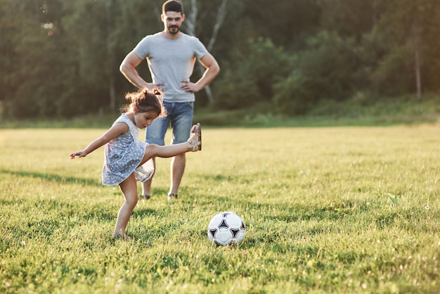 Thats how it does. Enthusiastic dad teaches daughter how to play his favourite game. It's soccer and even little girls can play it.