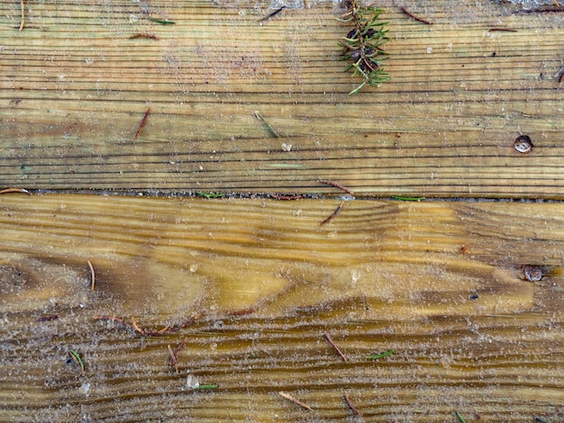 Thaw on the aged color wooden floor terrace