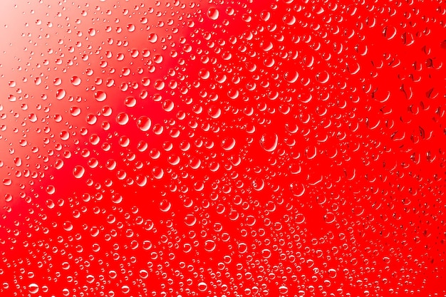 Фото Текстура воды капли на красной поверхности