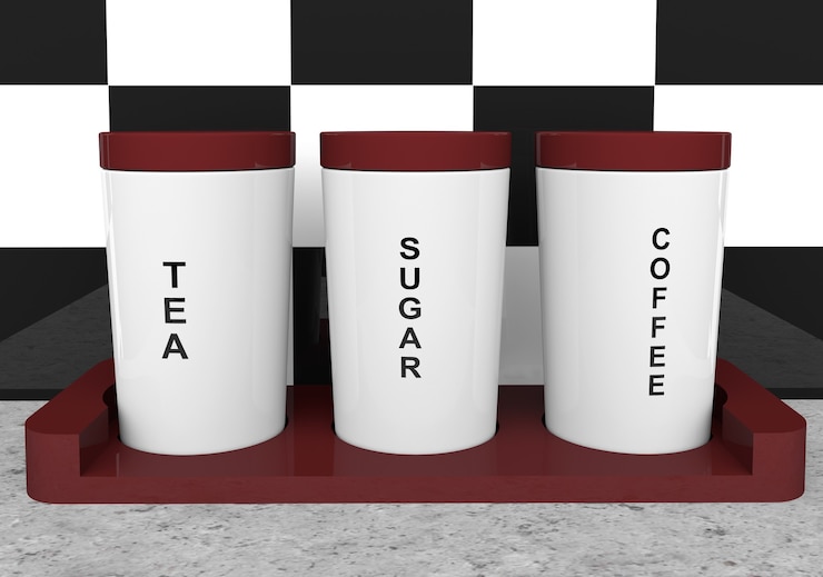Foto thee-, koffie- en suikerblikken met houten houder