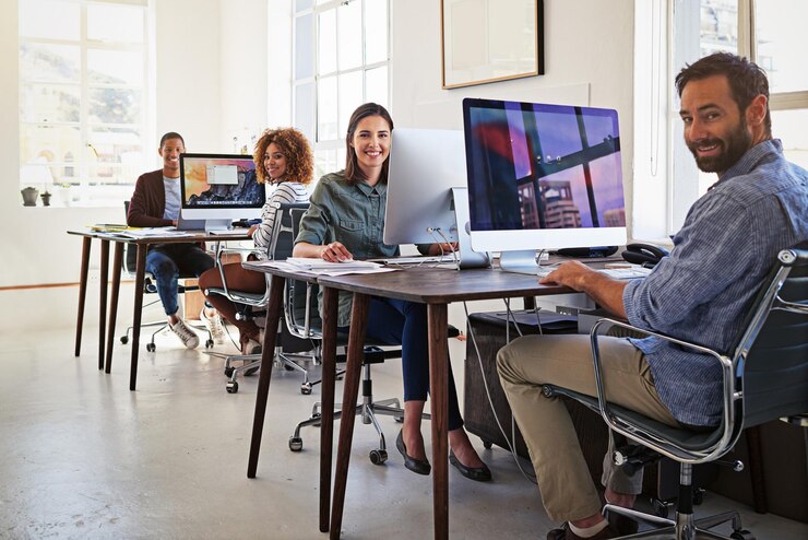Photo their office is wired for success portrait of colleagues working on their computers in an open plan office