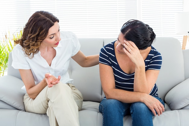 Therapist comforting her patient