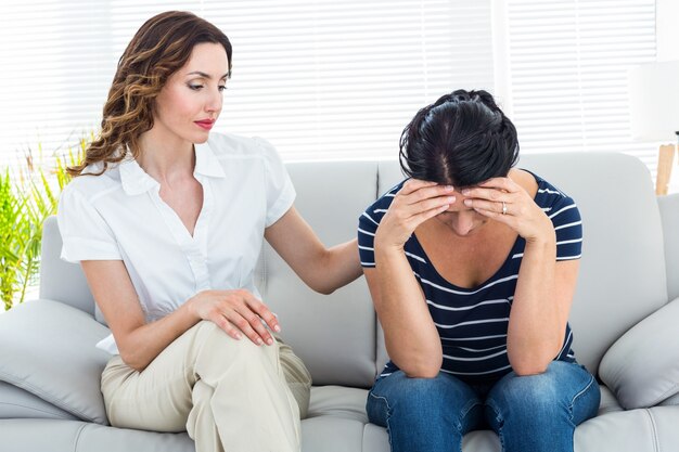 Therapist comforting her patient