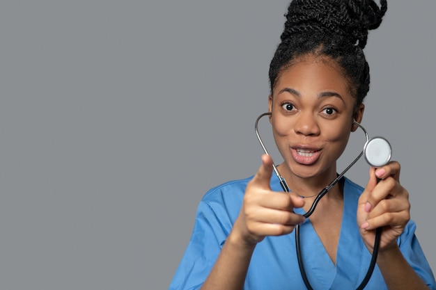 Therapist. Picture of a dark-skinned young doctor with stethoscope