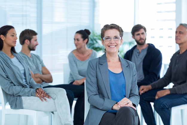 Photo therapist with group therapy in session