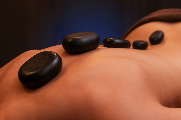 Photo therapy with hot stones in spa center
