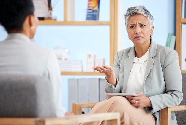 Therapy woman and psychologist with question consultation and discussion for mental health issues Therapist medical professional or female client in session conversation or advice for depression