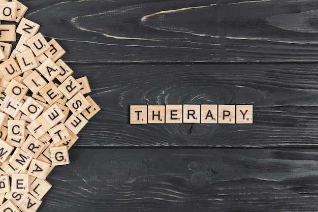 Therapy word on wooden background