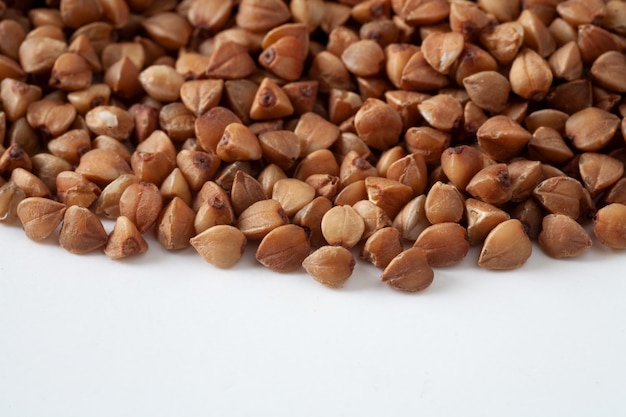 There are buckwheat grains on the table. Selective focus. Macro.