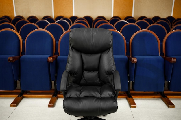 There are many chairs in a row in the Assembly hall Meeting or conference room