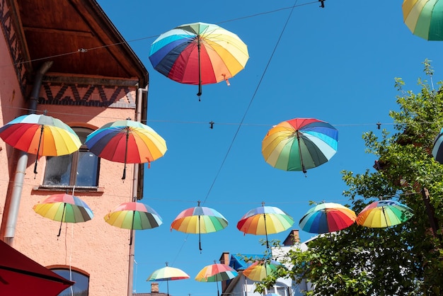 There are many colorful umbrellas in the sky