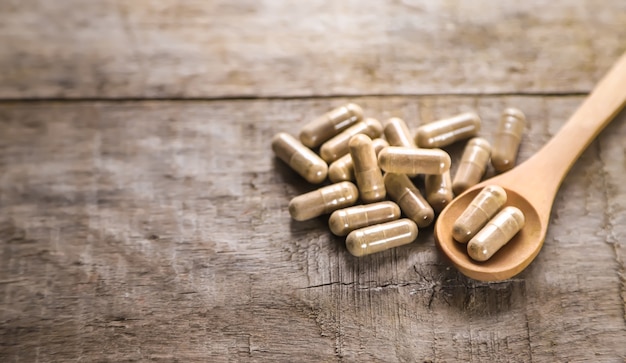 There are many herbal supplements in capsules. Selective focus. nature.