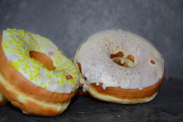 there are two donuts on the black table