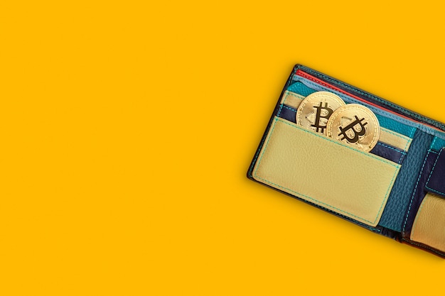 There is bitcoin Crypto currency coin in wallet pocket.