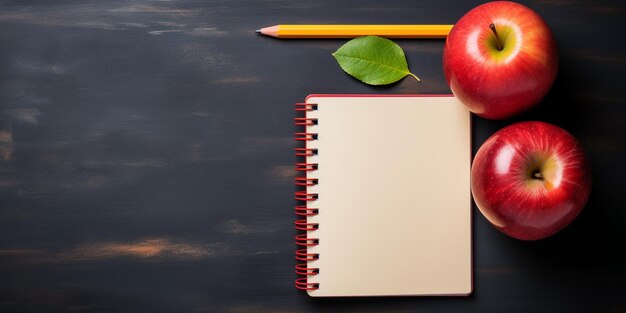 There is a notebook and two apples on a table with a pencil generative ai