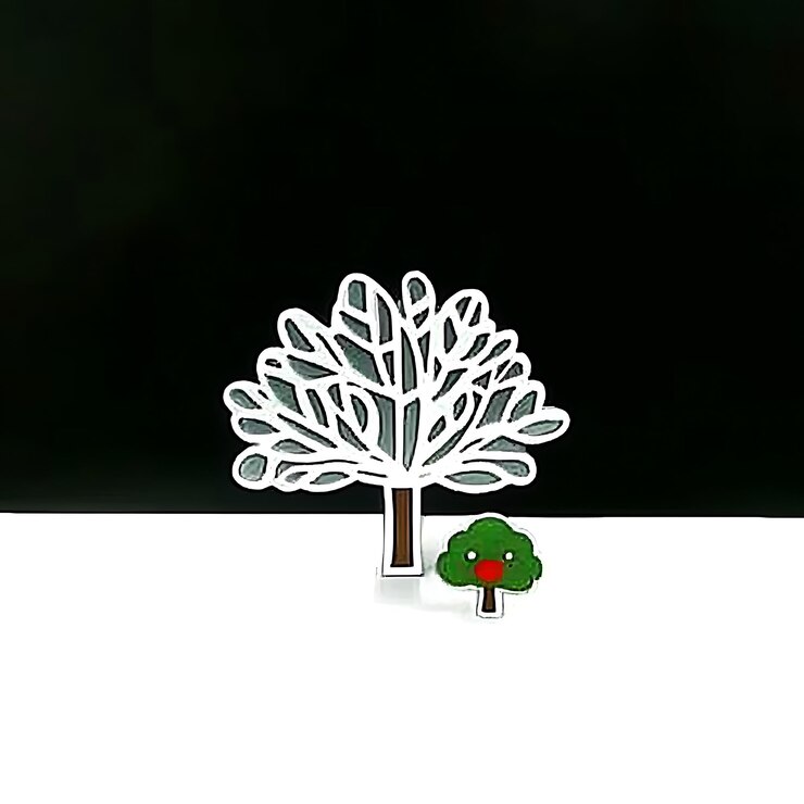 Photo there is a small tree and a small tree on a table