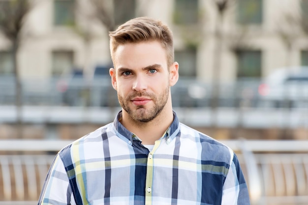 Theres no doubting he looks good. Unshaven man urban outdoors. Handsome guy with beard hair. Beard barber. Barbershop. Hair salon. Mens grooming. Beard trend will never truly be gone.