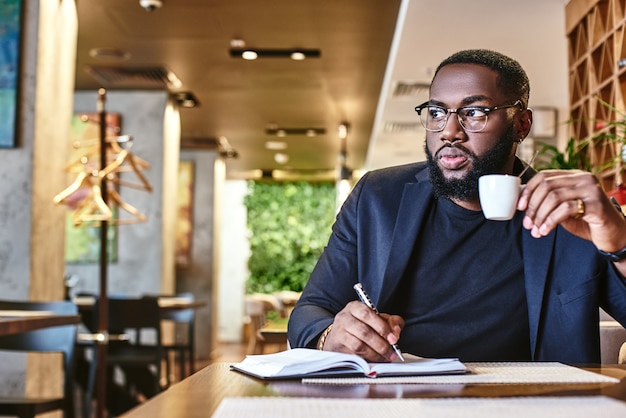 Theres no such thing as a free lunch portrait of a confident businessman making notes