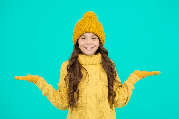 Thermal insulation Thermal garment shop Cute girl enjoy winter style Little kid wear knitted hat Stay warm Small child wear hat and sweater Cold weather Skin care Thermal protection concept