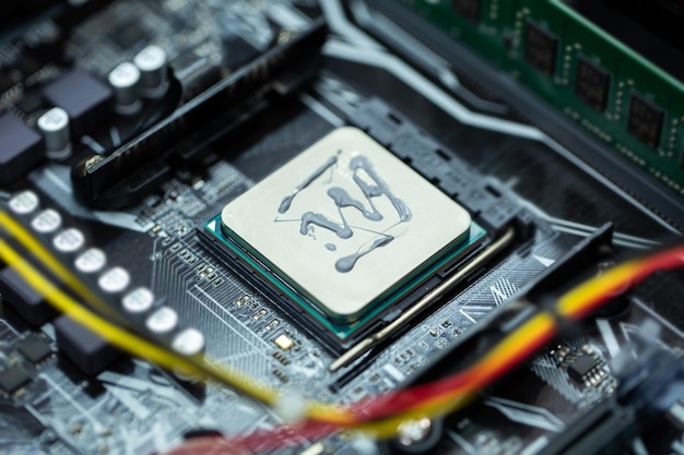 Thermal paste is applied to the laptop processor