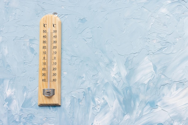 Photo thermometer shows low air temperature winter weather concept