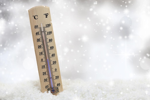 Thermometer on snow shows low temperatures