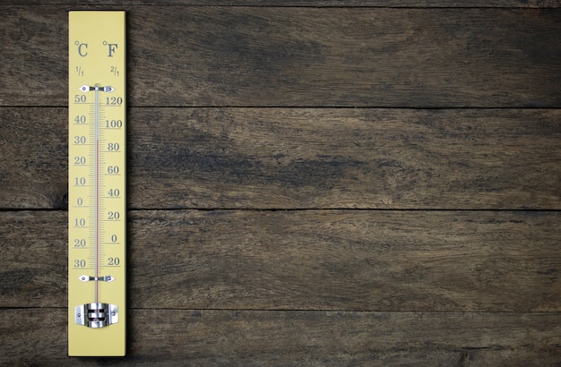 Photo thermometer on vintage wood wall