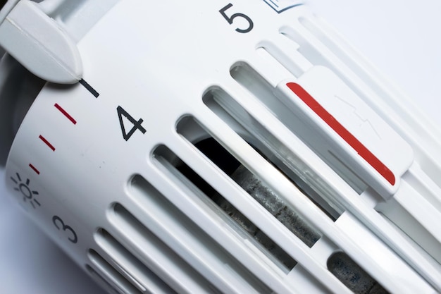 Thermostat of an heating radiator on white background