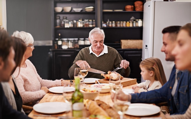 They always get together on special occasions Cropped shot of a family sitting down to dinner