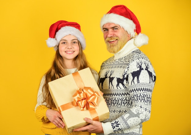 They love Christmas family exchange presents winter xmas mood new year is here dad and small girl