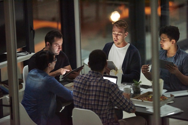 Theyre the dream team Shot of employees working in an office at night