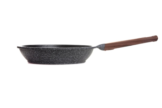 Thick black nonstick frying pan with brown handle on white background side view