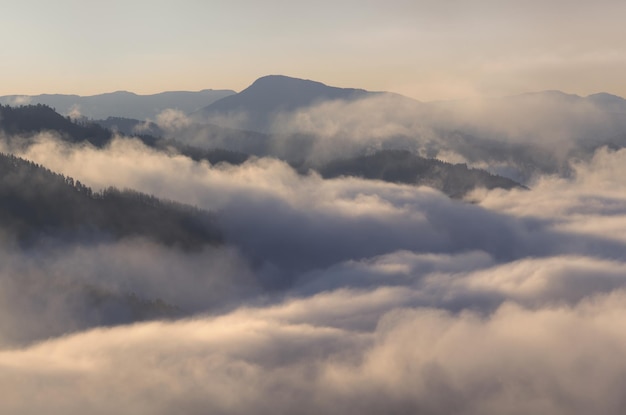 A thick fog covered the mountains a top view background