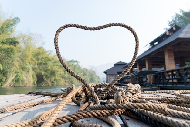 thick rope tie the heart shape on the wooden terrace