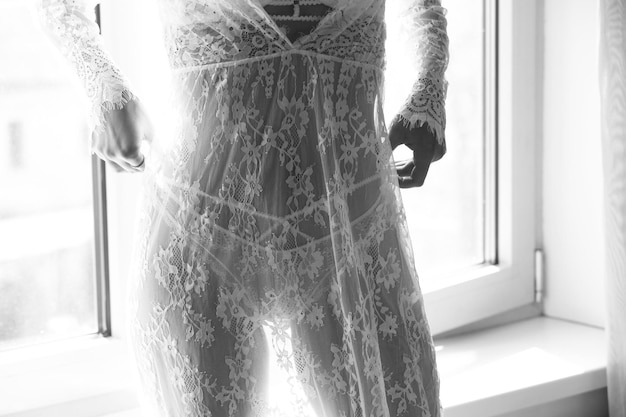 thighs of a woman in a lace transparent negligee