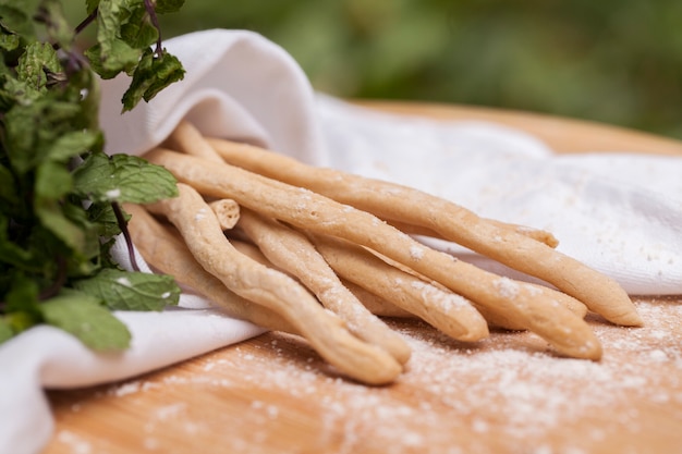 Thin Bread Sticks on cutting board