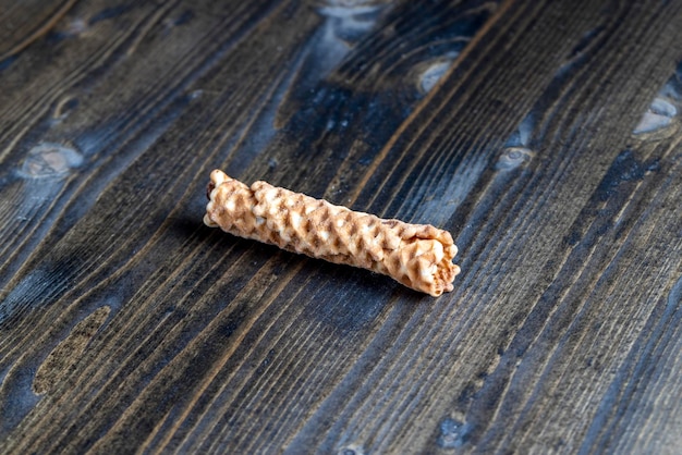 Thin crispy waffles lie on a black table