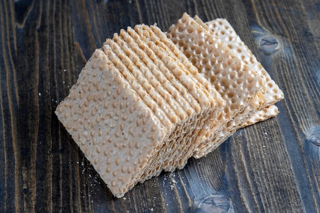 Thin crispy waffles made of wheat flour eggs and sugar thin wheat waffles are a type of dry biscuits that are used to prepare various dishes