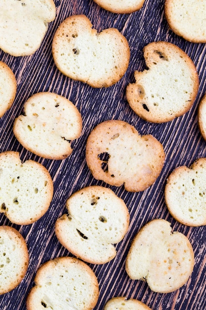 Thin fried rye crackers with spices . close-up of food made from wheat or other flour