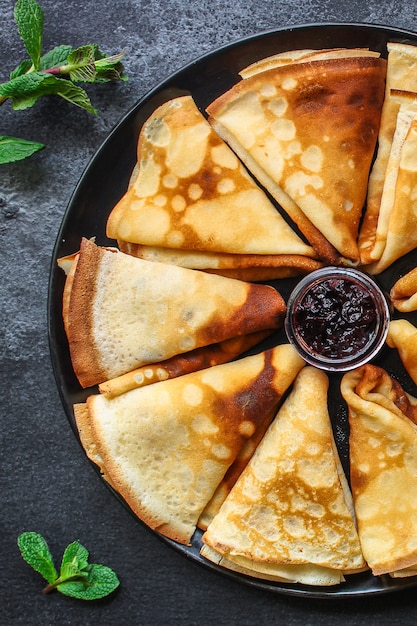 thin pancakes, crepes and jam