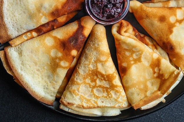 thin pancakes, crepes and jam