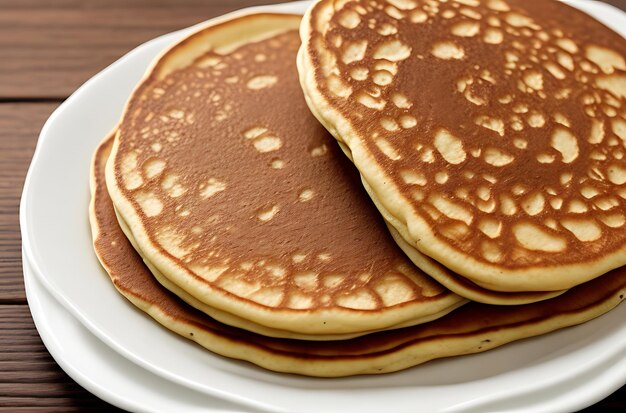 thin pancakes on a plate wooden backgrou