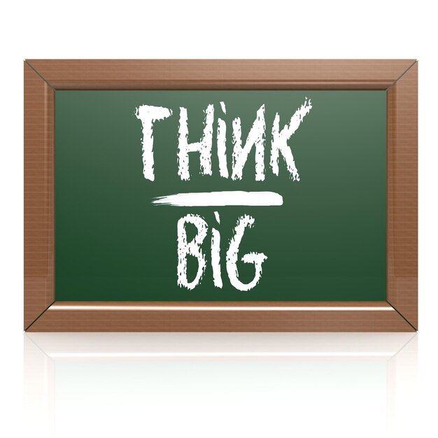 Think Big written with chalk on blackboard