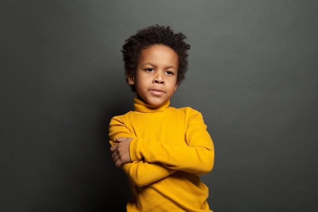 Thinking African American child boy ob black portrait